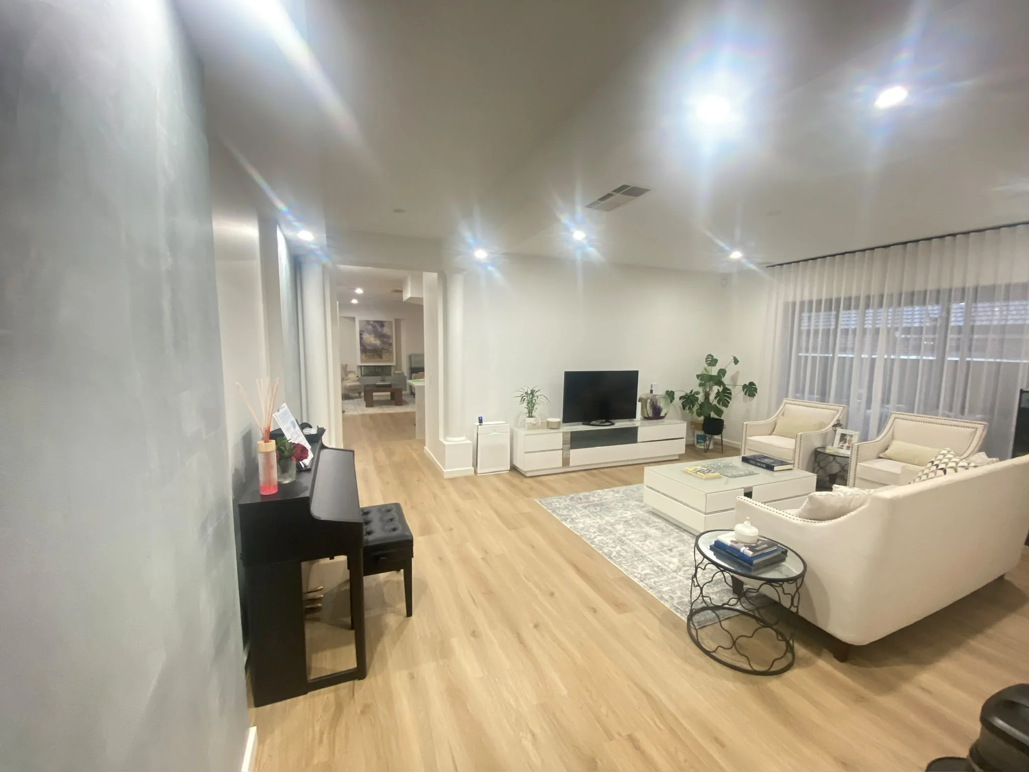 Living room with timber flooring and recessed lighting