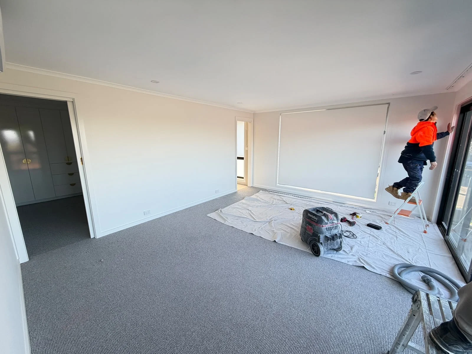 Renovation work in progress with a team member on site